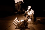 Street musician, downtown Washington DC. Trumpet and American flag.