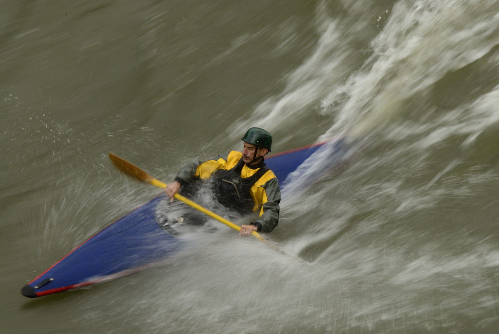 Kayaker in the waves on the Potomac River.