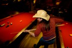 Cowgirl shooting pool in Jackson bar. Jackson, wyoming.