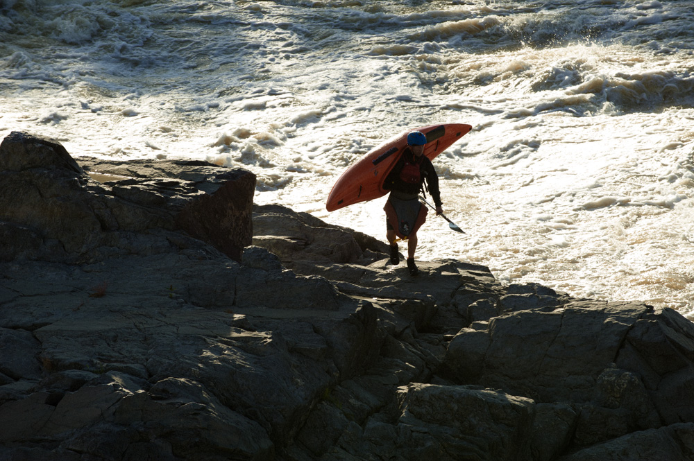 Jason Beakes climbing the rocks on the Potomac River at great Falls. Finlandia Vodka video shoot.