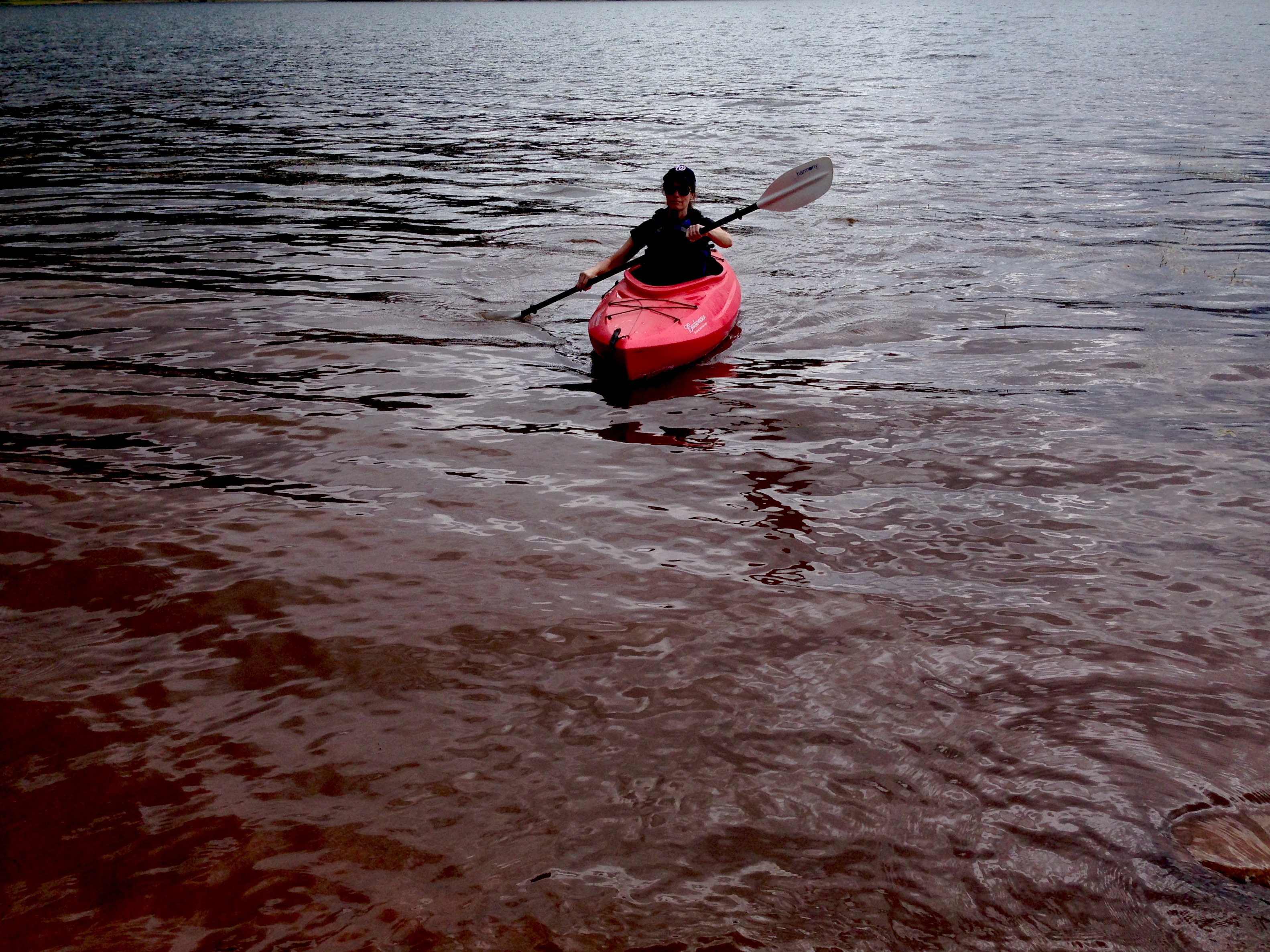 woman kayaking at lake vallecito. Vallecito, colorado.