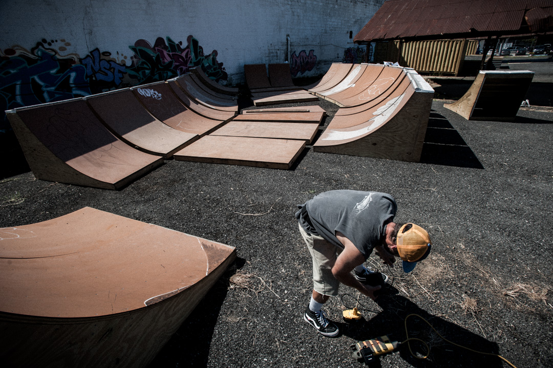 Ben Ashworth building a skate bowl in abandon lot near Union Market, DC.