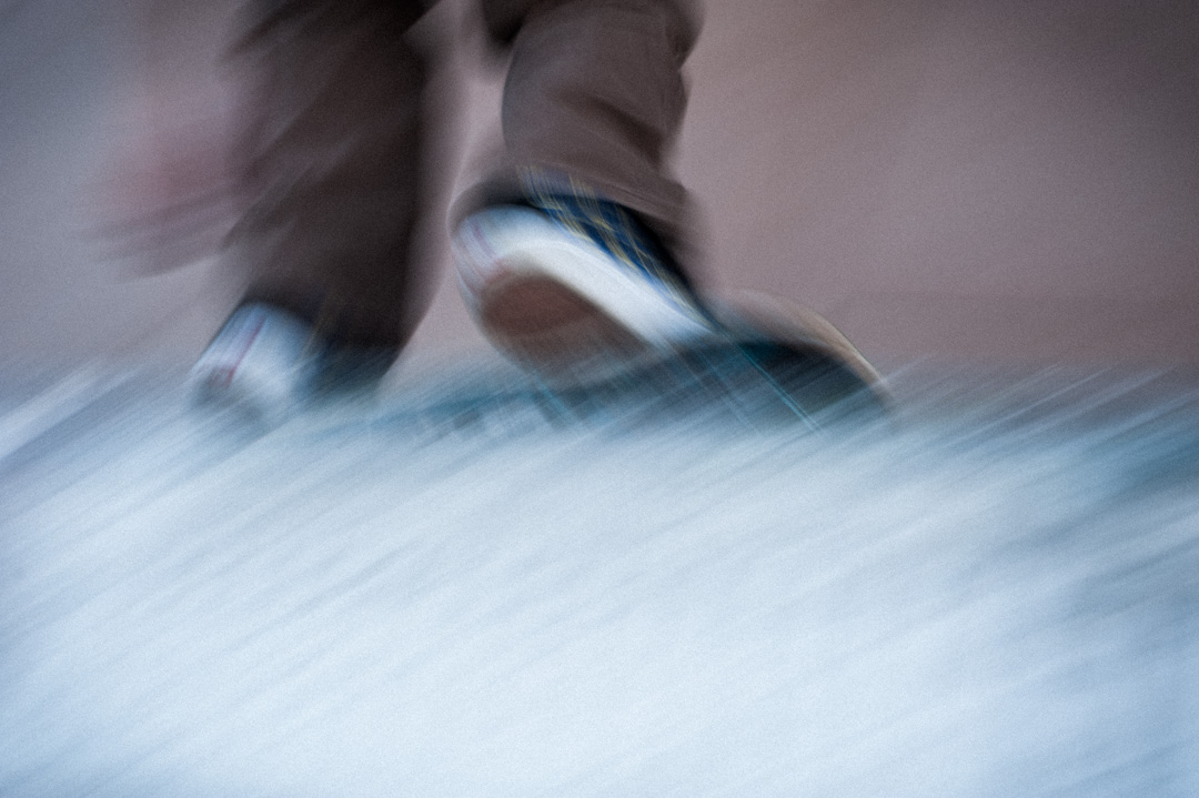 Ben Ashworth's feet and board. skating right up against the coping.