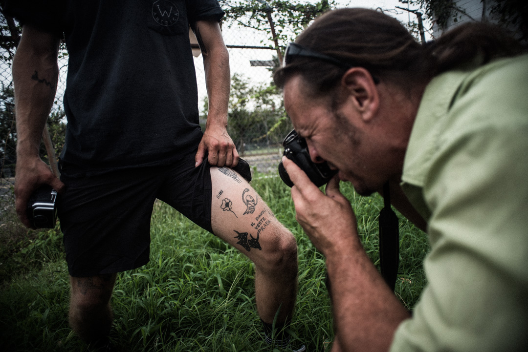 Tony Smallwood photographs Max Hoffman's self-tattooed leg.