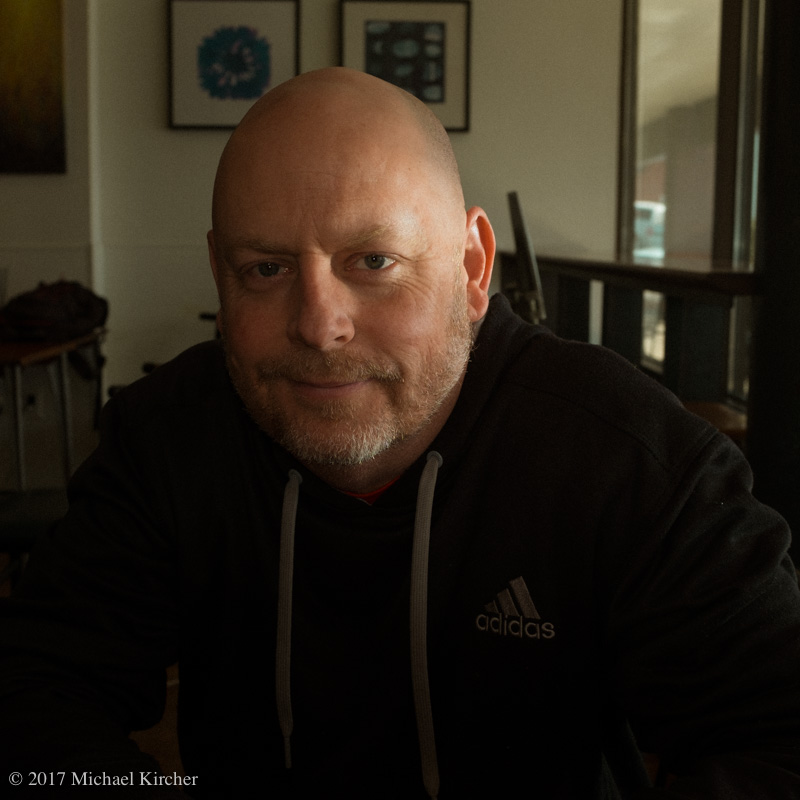 Portrait of John. Fuji X100S. 1/125 sec f 5.6. Built in flash fired at -1.3 (I believe!) Fills in shadow side of face just a touch. Small catch light in eyes.